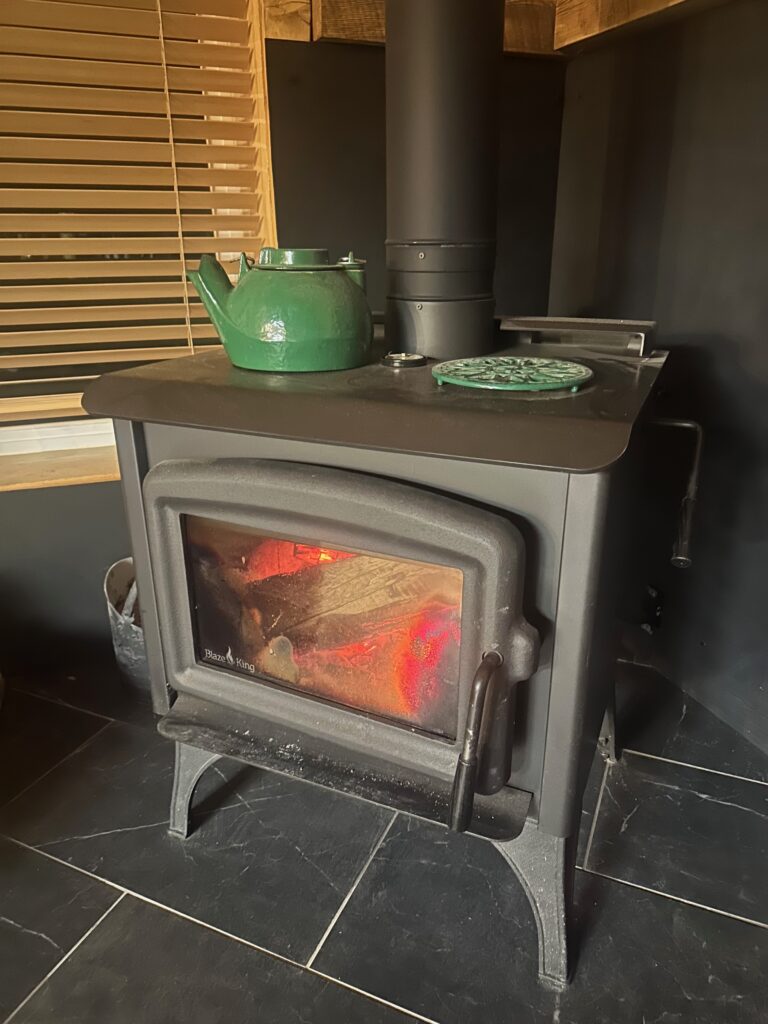 Cozy fireplace in a Dutch John cabin, ideal for relaxation.