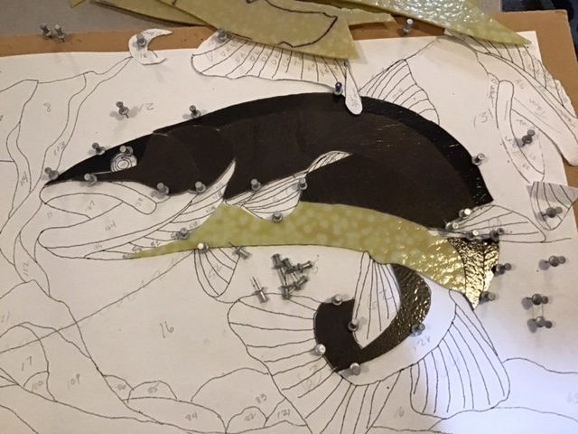 Close-up view of pieces being assembled directly on template.