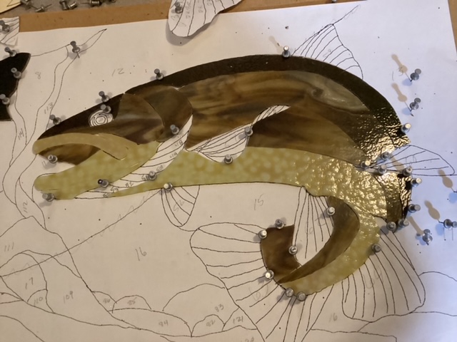 Brown trout panel laid out on template with glass pinned in place.